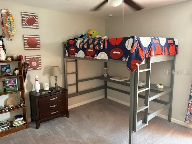 a view of kids room with toys and a window