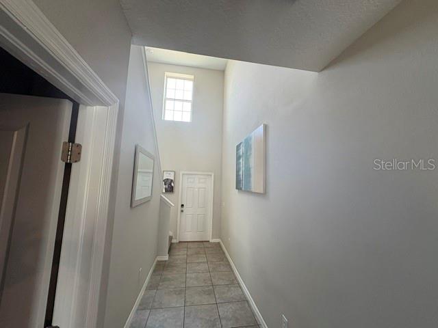 9616 Lemon Drop Loop Sun City Center, FL 33573 - Photo 8 of 48 a view of a bathroom from a hallway