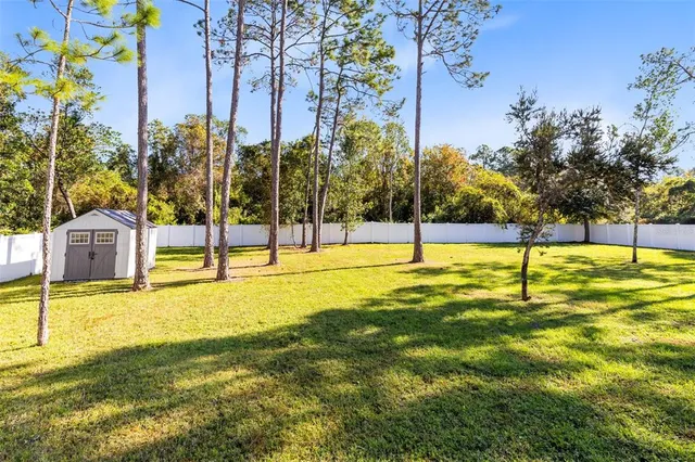 a swimming pool with an outdoor space and seating area