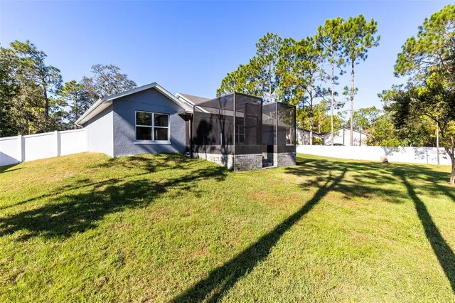 a swimming pool with trees in the background
