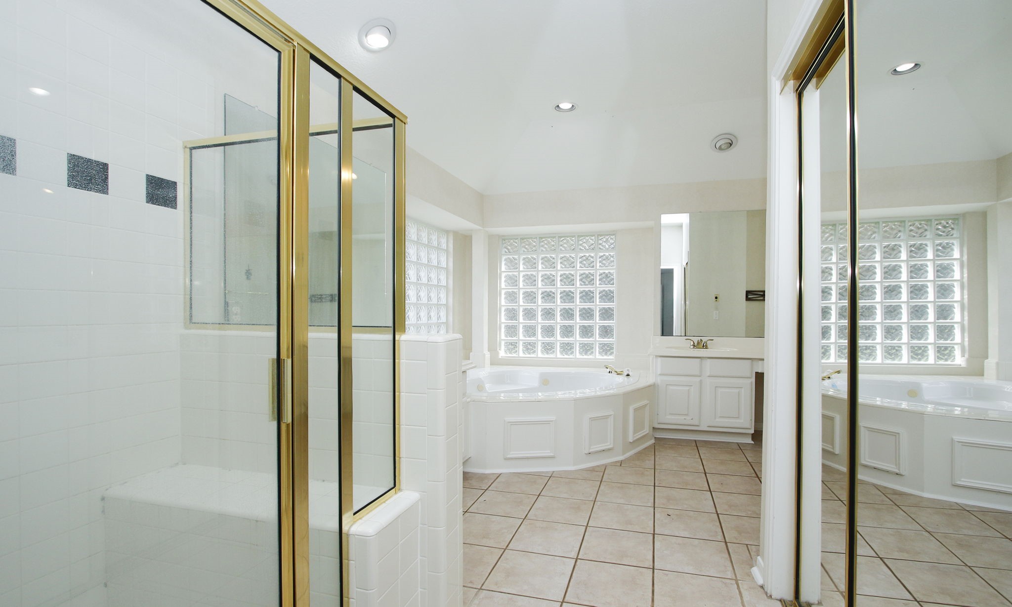 20206 Treetop Lane Spring, TX 77388 - Photo 24 of 42 a bathroom with a bathtub sink and toilet
