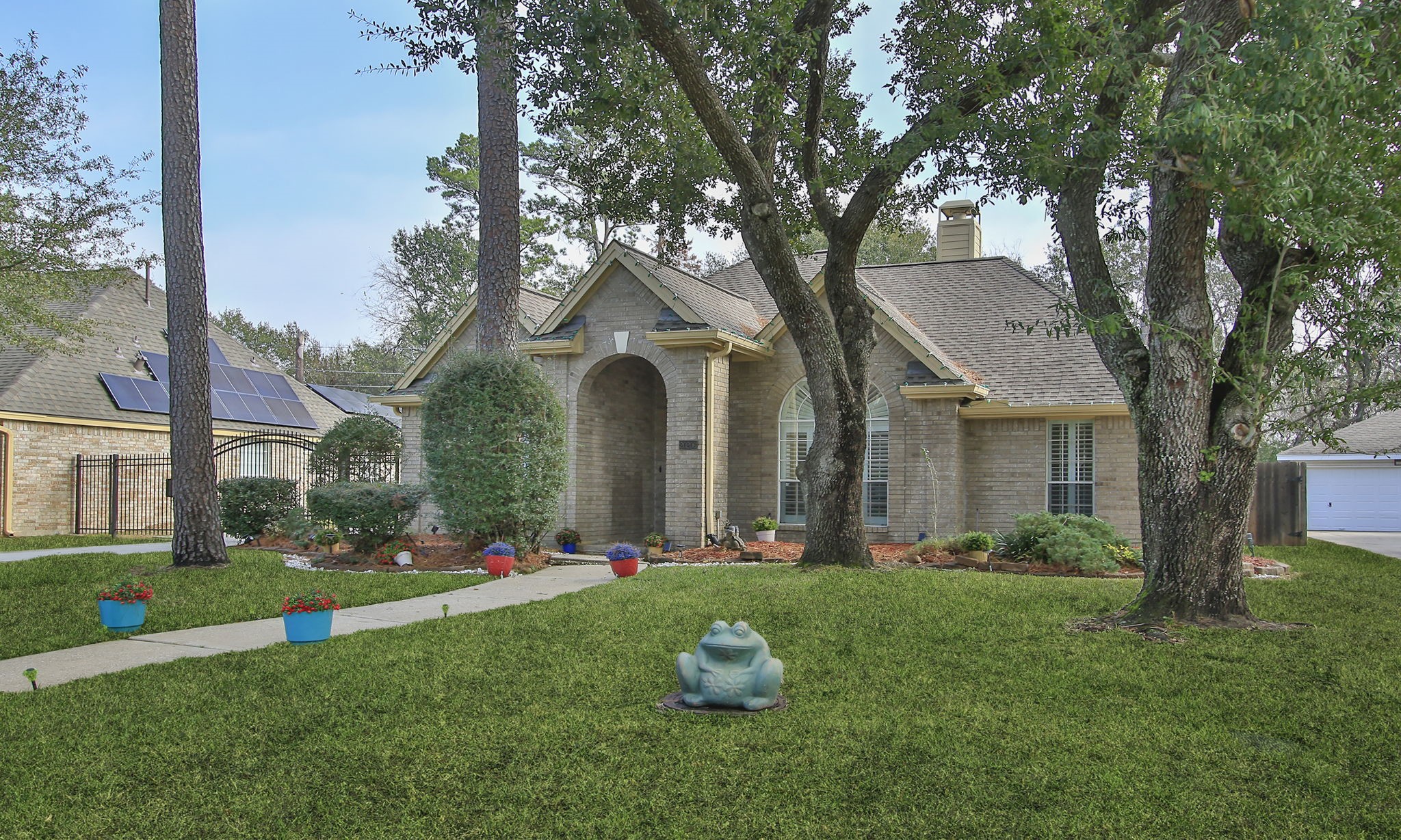 20206 Treetop Lane Spring, TX 77388 - Photo 3 of 42 a front view of a house with garden