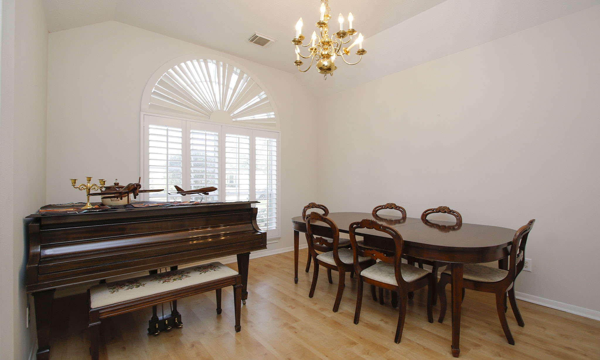 20206 Treetop Lane Spring, TX 77388 - Photo 10 of 42 a view of a dining room with furniture and a chandelier