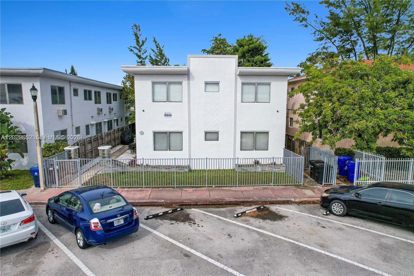 855 80th Street, Unit 4 Miami Beach, FL 33141 - Photo 1 of 16 a car parked in front of a house