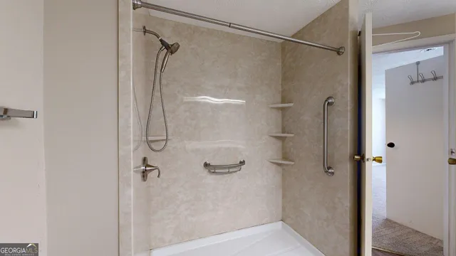 a bathroom with a glass shower door