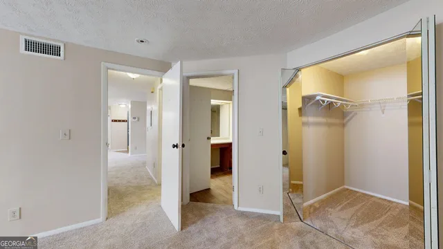 wooden view of a bathroom with a glass door shower