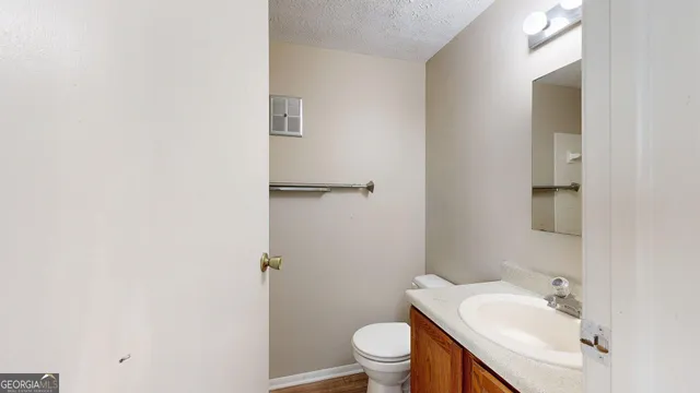 a bathroom with a sink and toilet