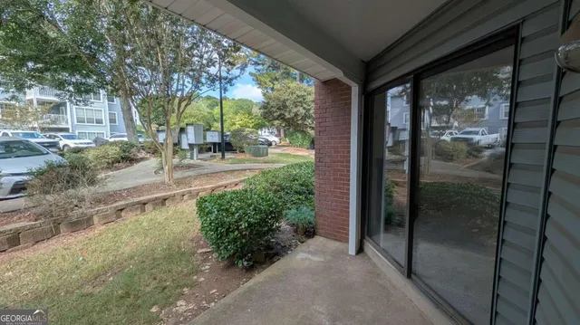 a view of backyard with plants and garden