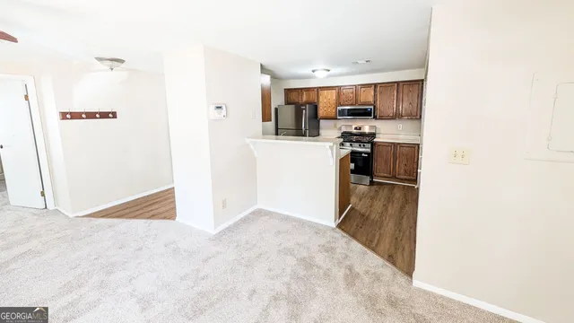 a view of a kitchen with a sink