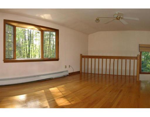 286 Hill Road Groton, MA 01450 - Photo 3 of 6 a view of an empty room with a window