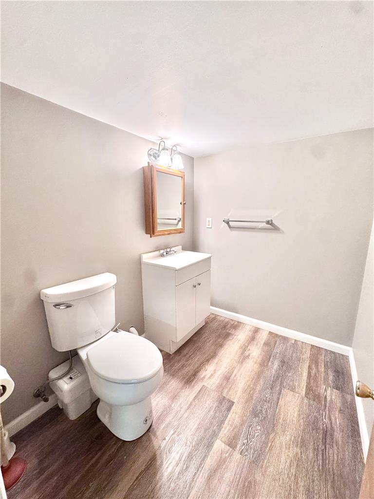 5454 Camp Meeting Road Center Valley, PA 18034 - Photo 23 of 27 A well-maintained bathroom with a modern vanity and stylish wood-look flooring.