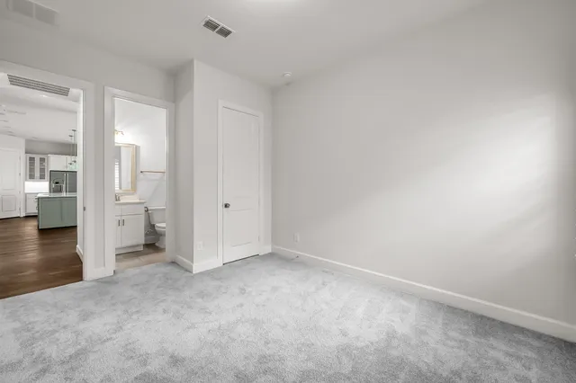 a view of a room with wooden floor and window