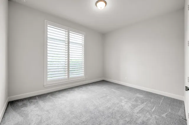 a bathroom with a double vanity sink toilet mirror and shower