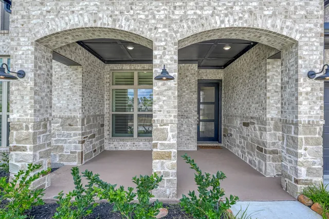 a front view of a house with a garage