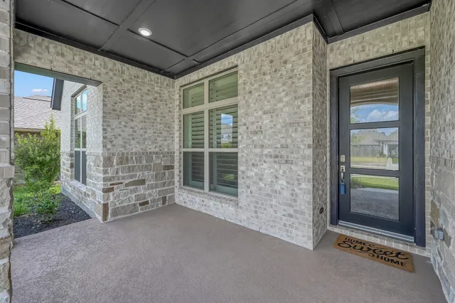 a view of a hallway with a wooden floor