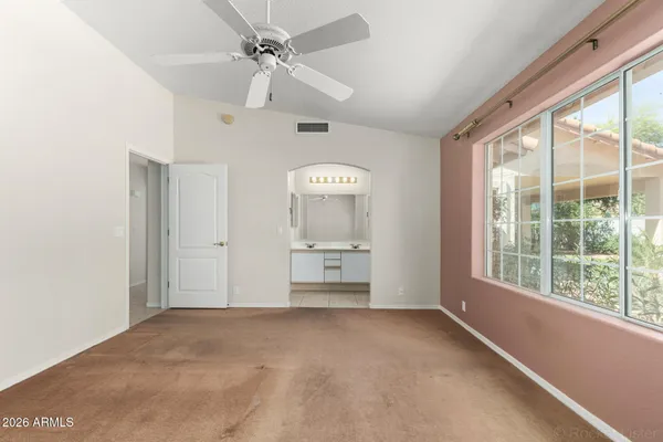 a view of an empty room with a window