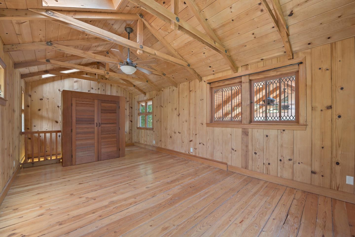 41 Skyline Drive Woodside, CA 94062 - Photo 13 of 30 a view of an empty room with wooden floor and a window