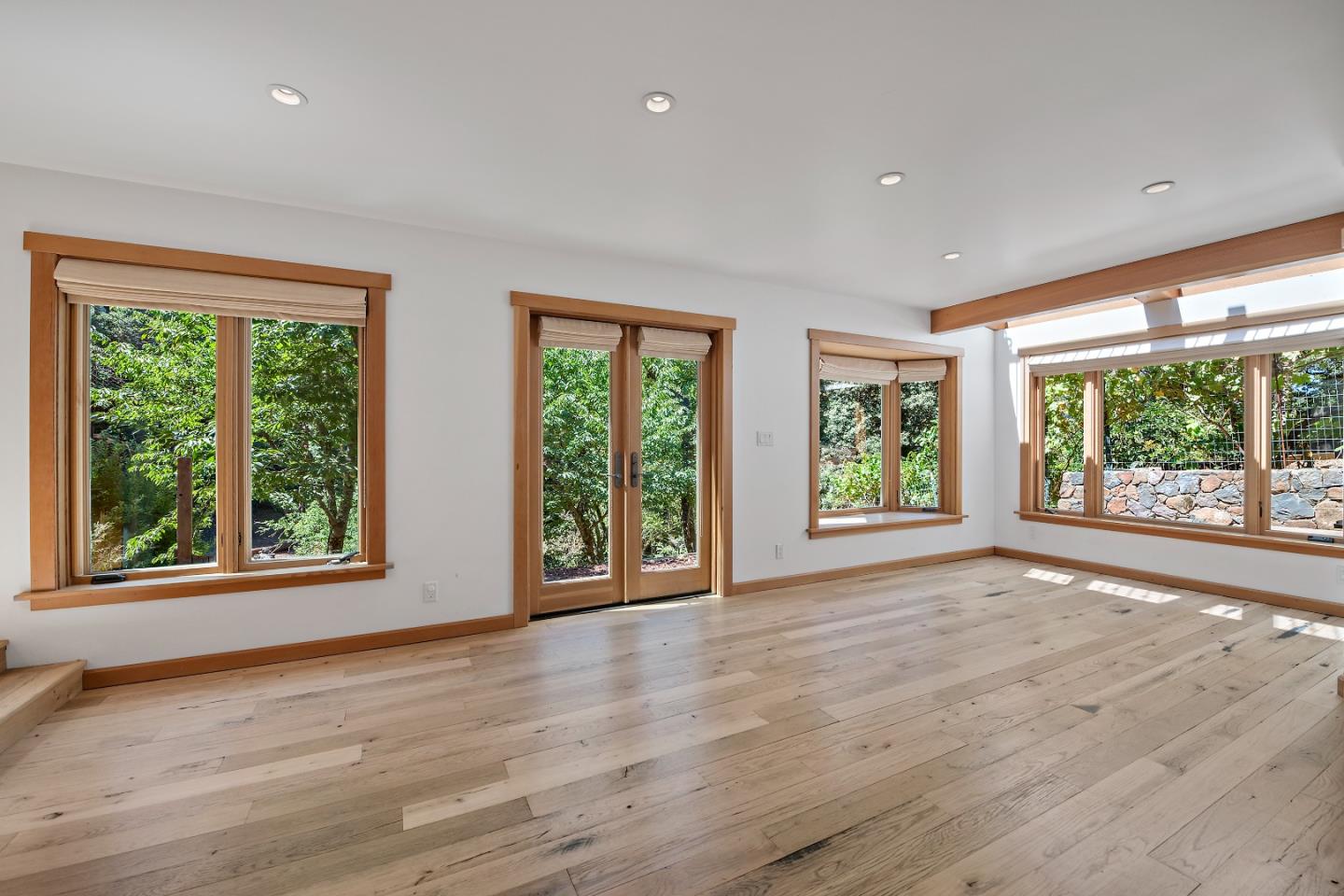 41 Skyline Drive Woodside, CA 94062 - Photo 16 of 30 a view of an empty room with wooden floor and windows