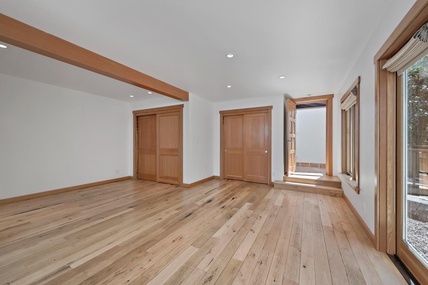 41 Skyline Drive Woodside, CA 94062 - Photo 17 of 30 a view of an empty room with wooden floor and a window