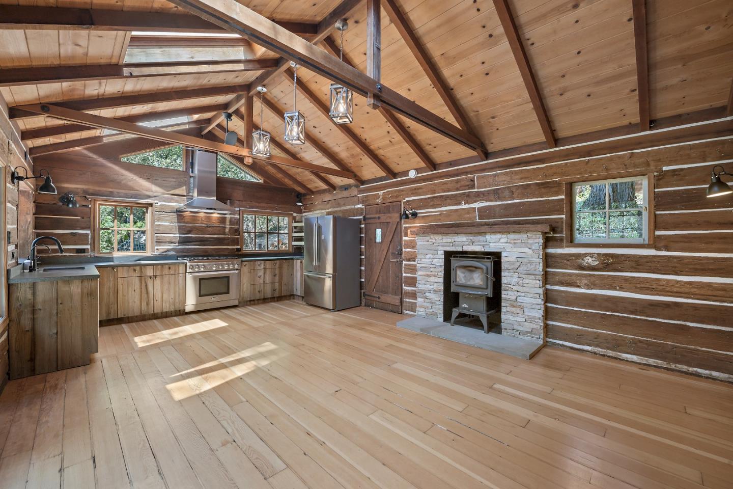 41 Skyline Drive Woodside, CA 94062 - Photo 7 of 30 a view of kitchen with stainless steel appliances wooden floor and fireplace