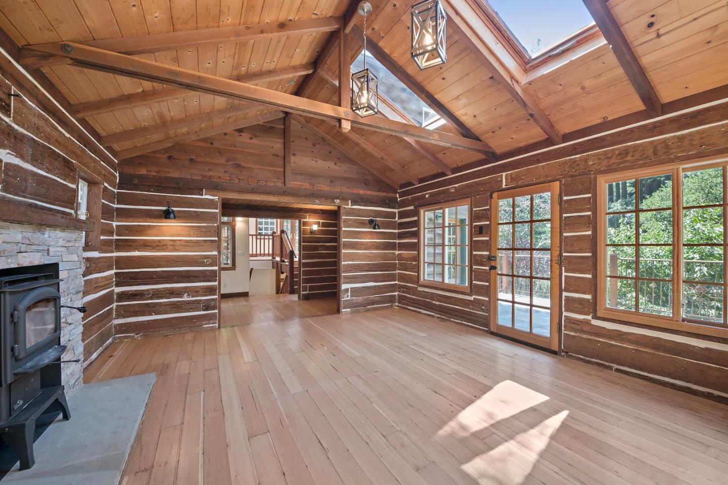 41 Skyline Drive Woodside, CA 94062 - Photo 8 of 30 a view of empty room with wooden floor and windows