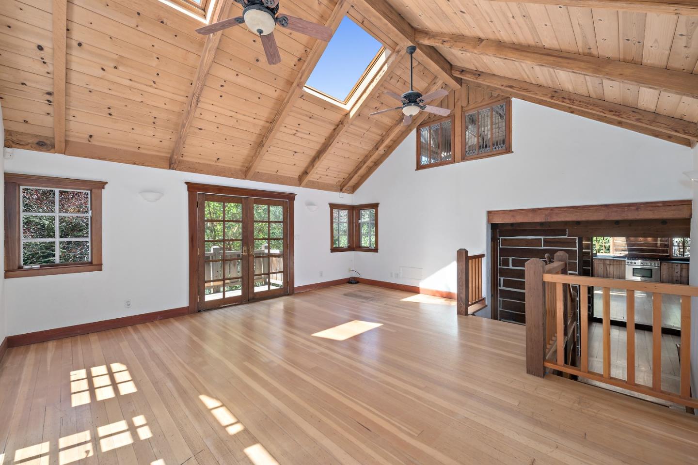 41 Skyline Drive Woodside, CA 94062 - Photo 10 of 30 a view of an empty room with window and wooden floor