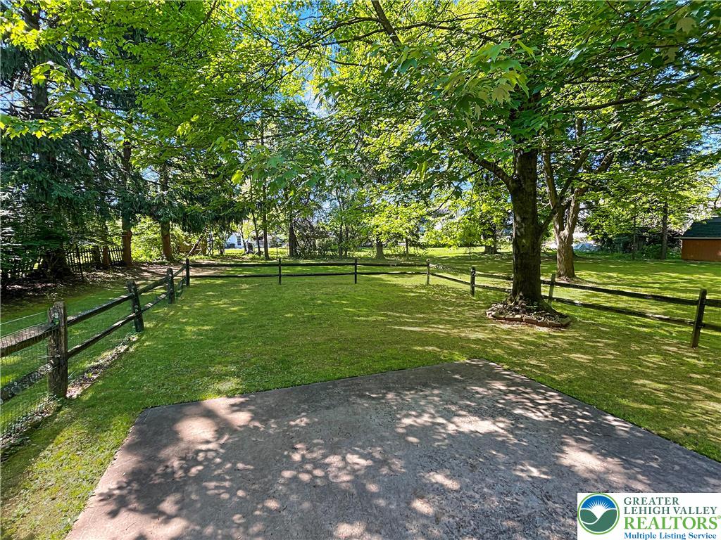 3406 Church Road Easton, PA 18045 - Photo 31 of 39 A spacious backyard with mature trees provides ample shade and privacy for outdoor enjoyment.