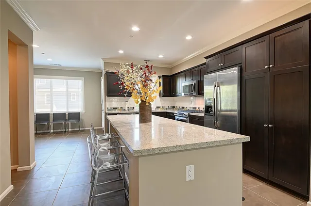 a kitchen with a sink stove and microwave