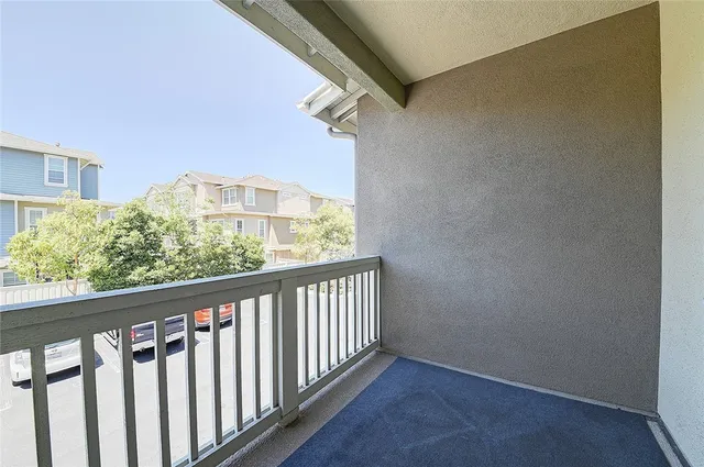 a living room with a washing machine and a sink