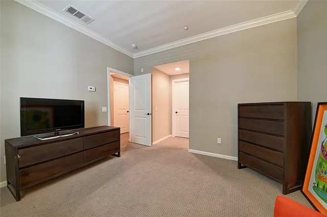 a living room with furniture and flat screen tv