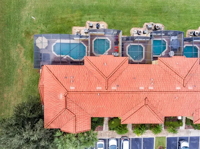 an aerial view of a house with outdoor space