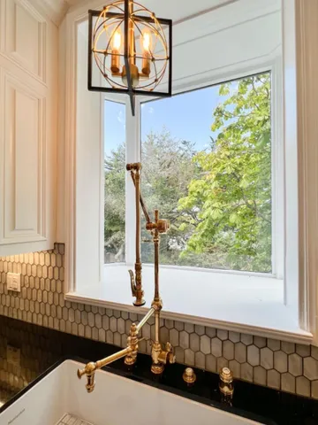 a bathroom with a bathtub and a sink