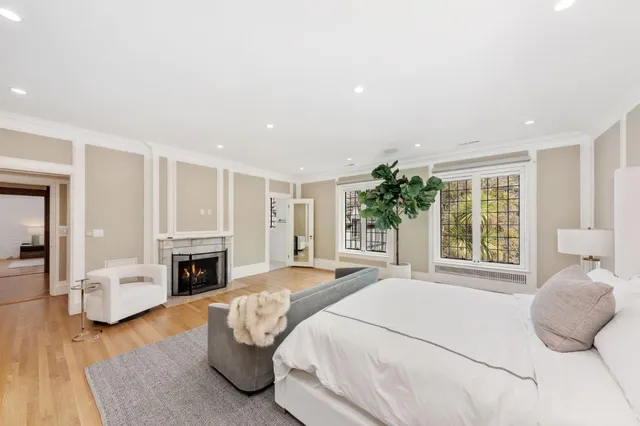 a bathroom with a double vanity sink toilet and shower