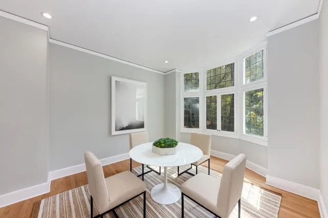 a large kitchen with stainless steel appliances a refrigerator and a stove top oven