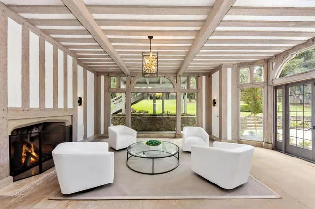 a front view of a house with a garden