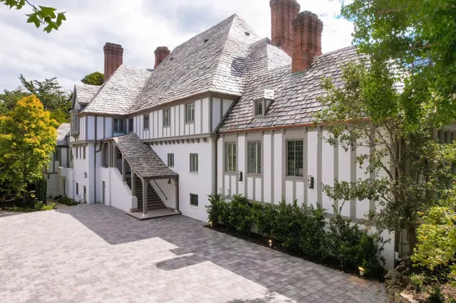 a front view of a house with garden