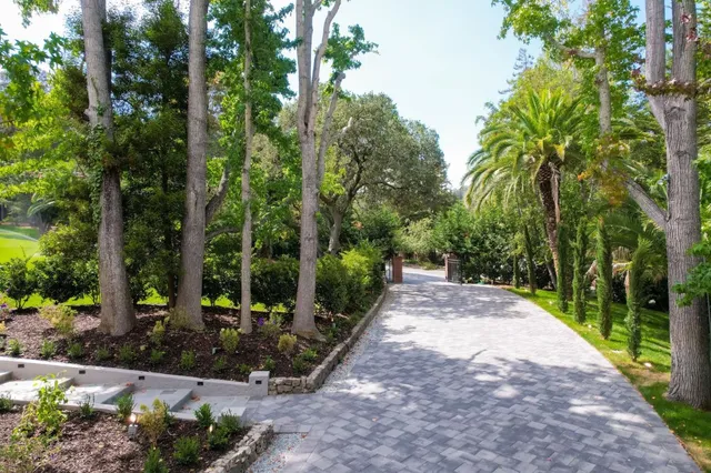 a living room with furniture large window and a fireplace