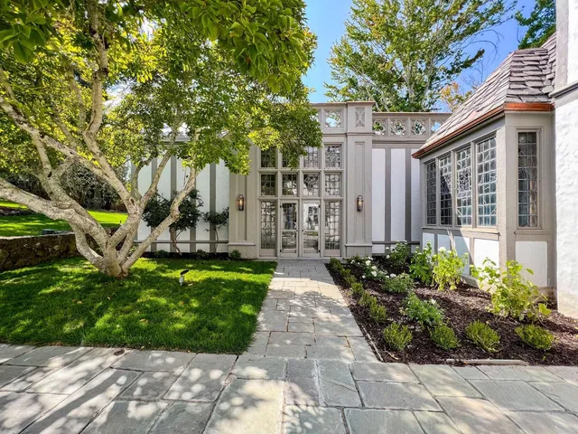 an aerial view of a house with a yard