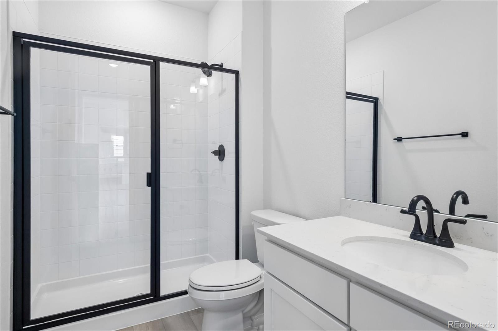 2536 West Bitterroot Place Highlands Ranch, CO 80129 - Photo 13 of 33 a bathroom with a sink and a mirror
