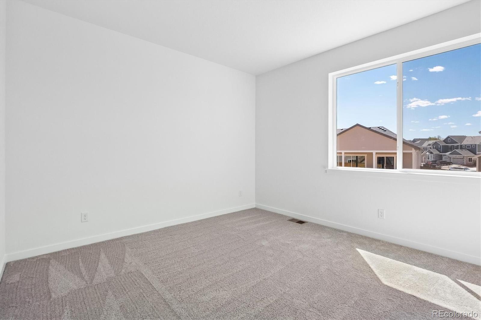2536 West Bitterroot Place Highlands Ranch, CO 80129 - Photo 14 of 33 an empty room with a window