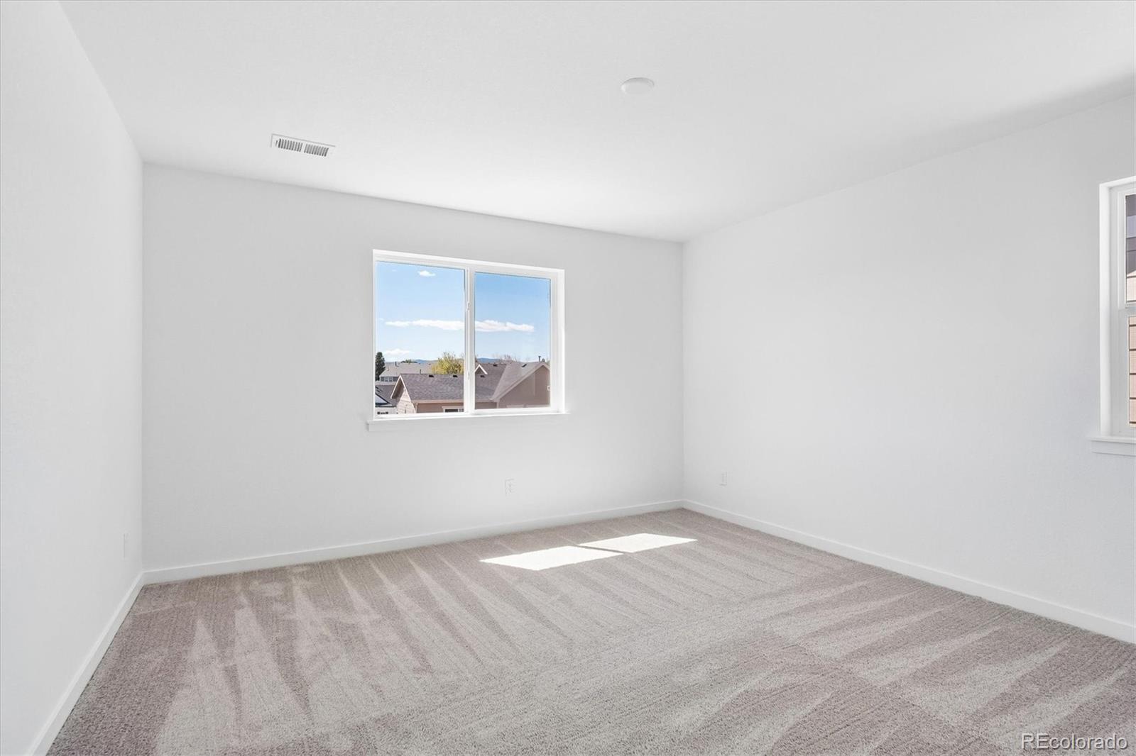 2536 West Bitterroot Place Highlands Ranch, CO 80129 - Photo 21 of 33 an empty room with a window