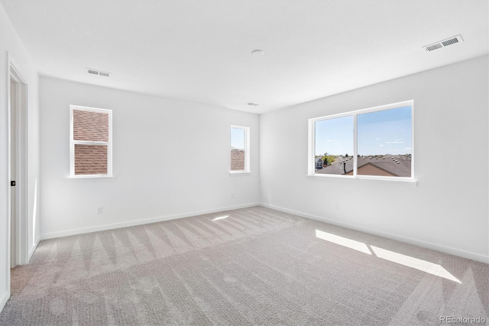 2536 West Bitterroot Place Highlands Ranch, CO 80129 - Photo 23 of 33 an empty room with windows