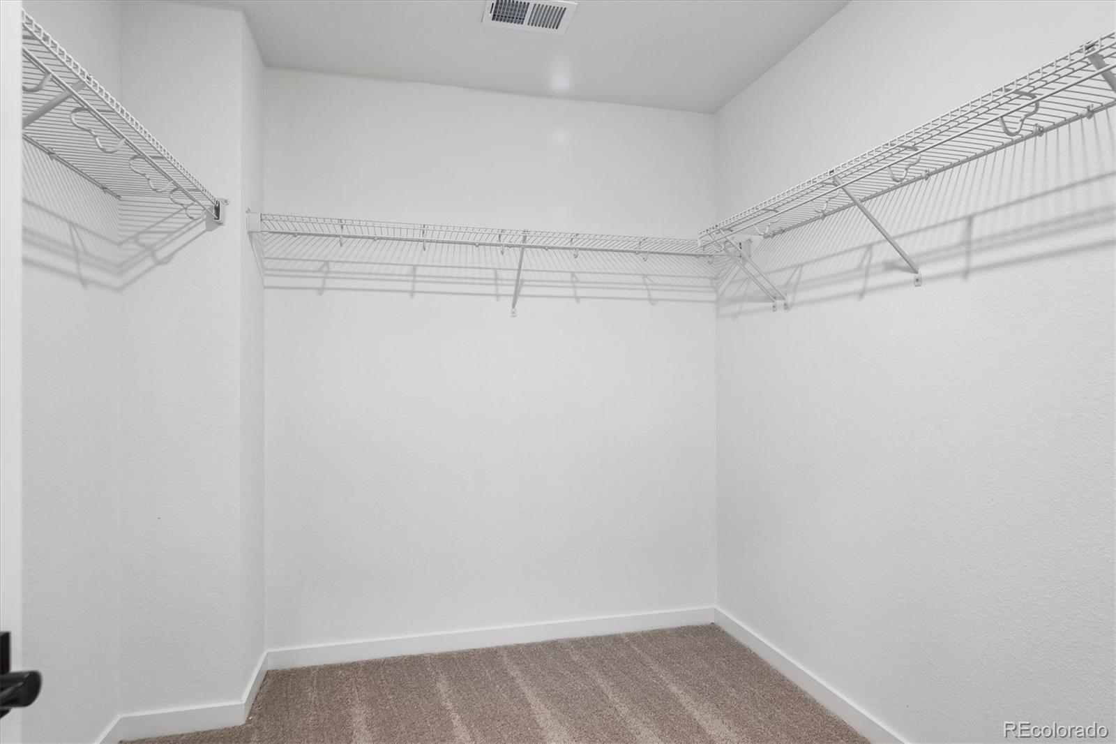 2536 West Bitterroot Place Highlands Ranch, CO 80129 - Photo 26 of 33 a view of a room with racks on the wall