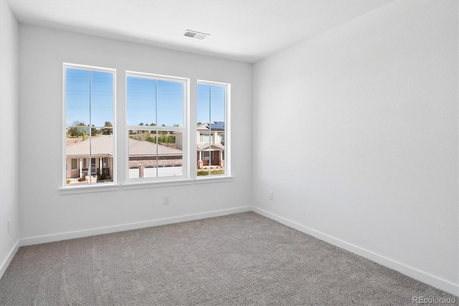 2536 West Bitterroot Place Highlands Ranch, CO 80129 - Photo 28 of 33 an empty room with windows