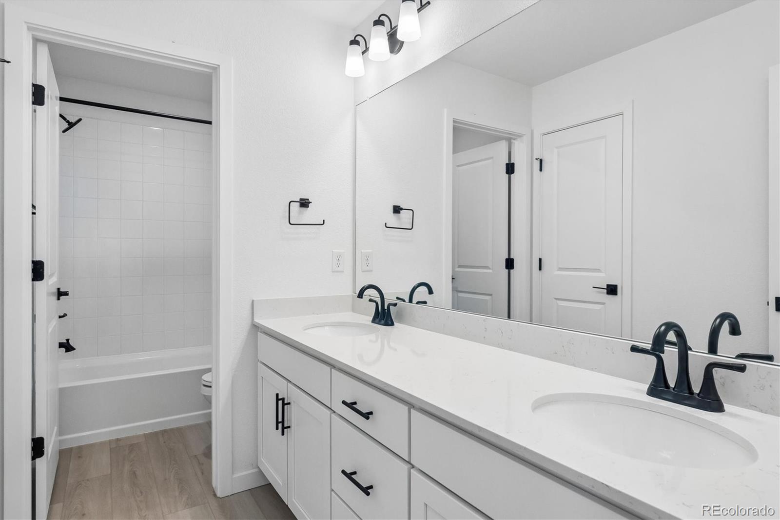 2536 West Bitterroot Place Highlands Ranch, CO 80129 - Photo 29 of 33 a bathroom with a sink and a tub