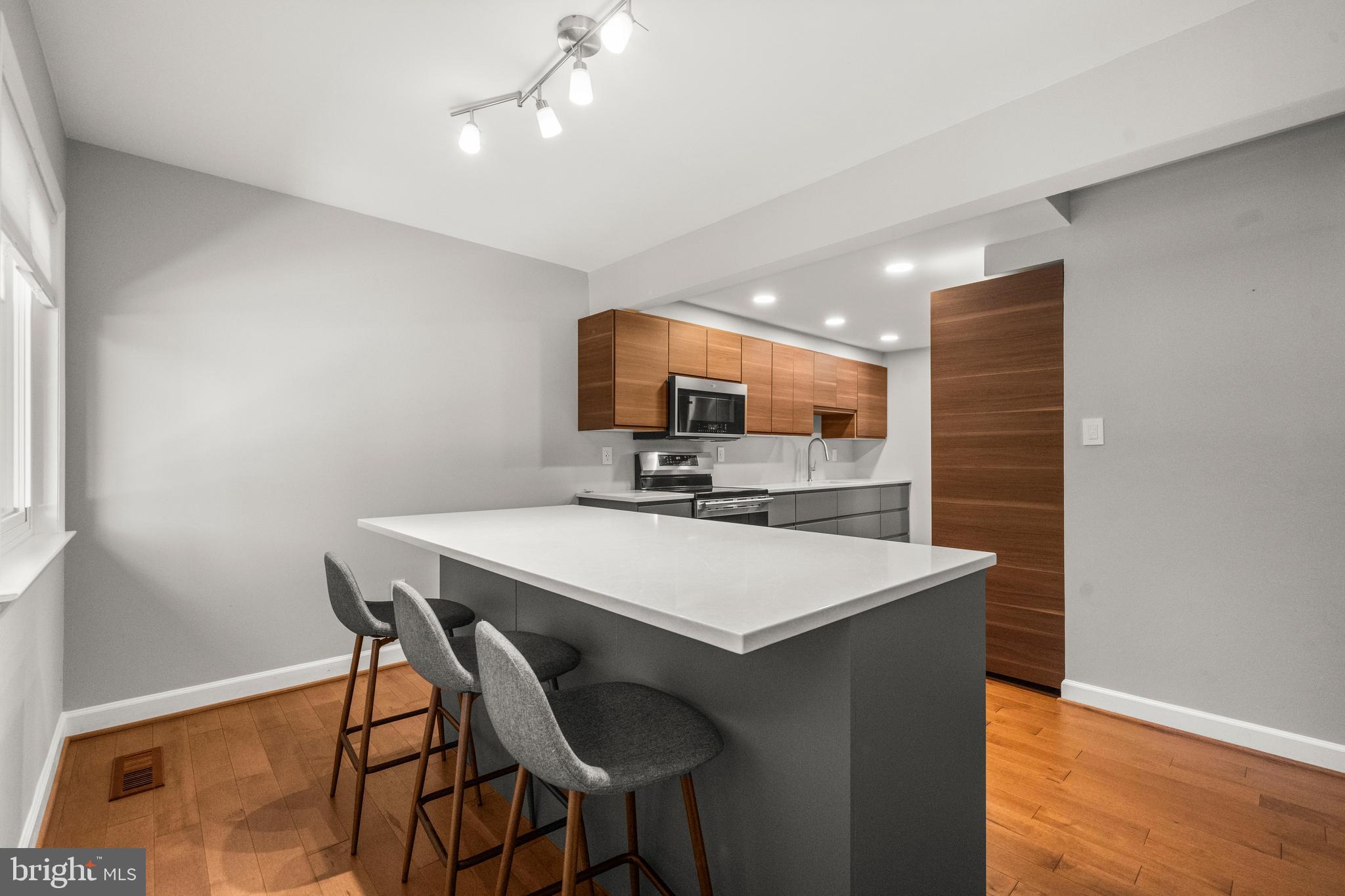 2152 Glencourse Lane Reston, VA 20191 - Photo 12 of 52 a view of a dining room with furniture and wooden floor