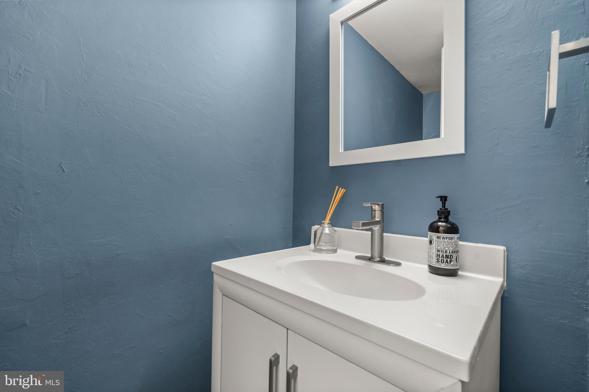 2152 Glencourse Lane Reston, VA 20191 - Photo 15 of 52 a bathroom with a sink and a mirror