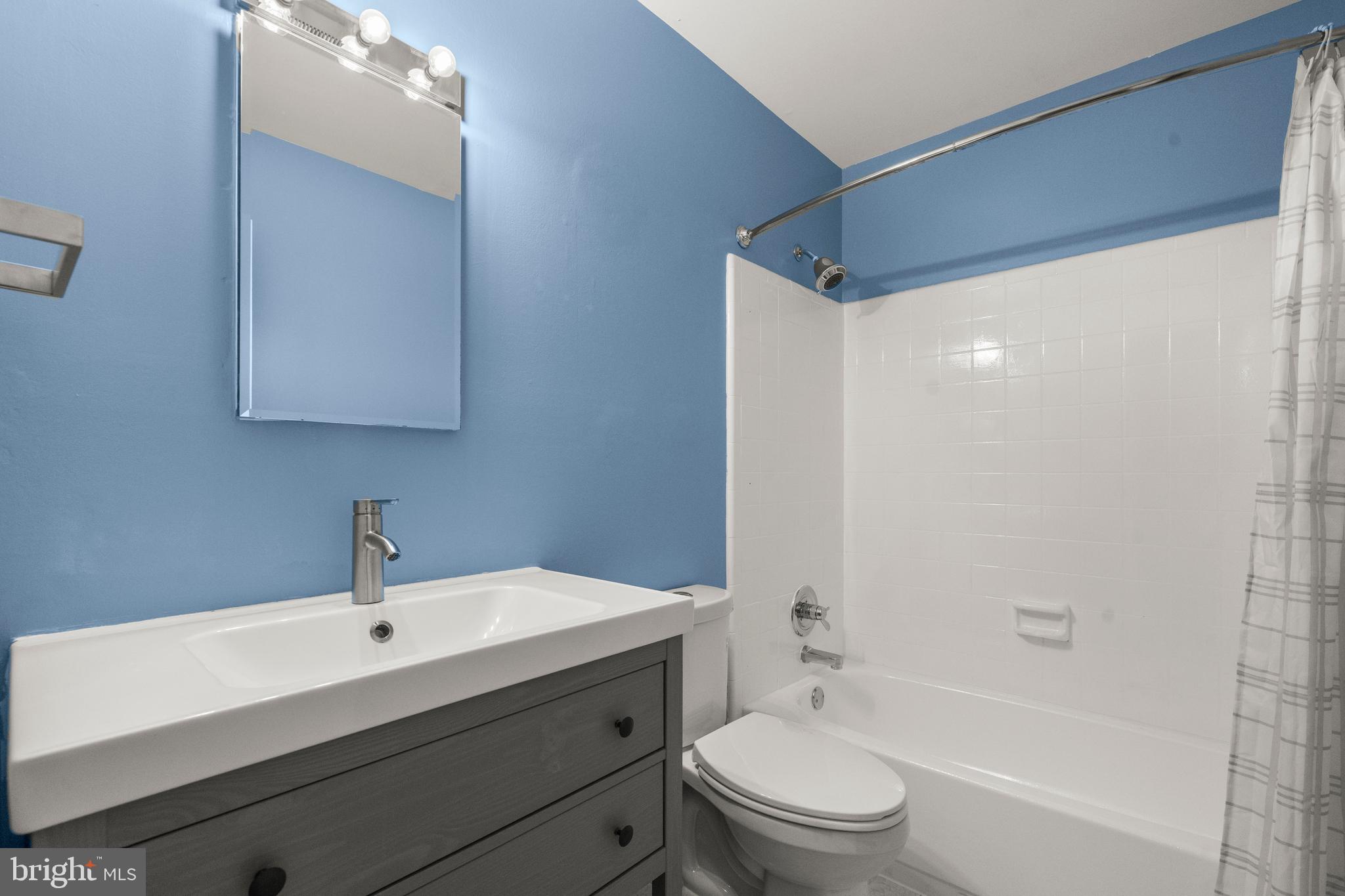 2152 Glencourse Lane Reston, VA 20191 - Photo 28 of 52 a bathroom with a sink a toilet and shower
