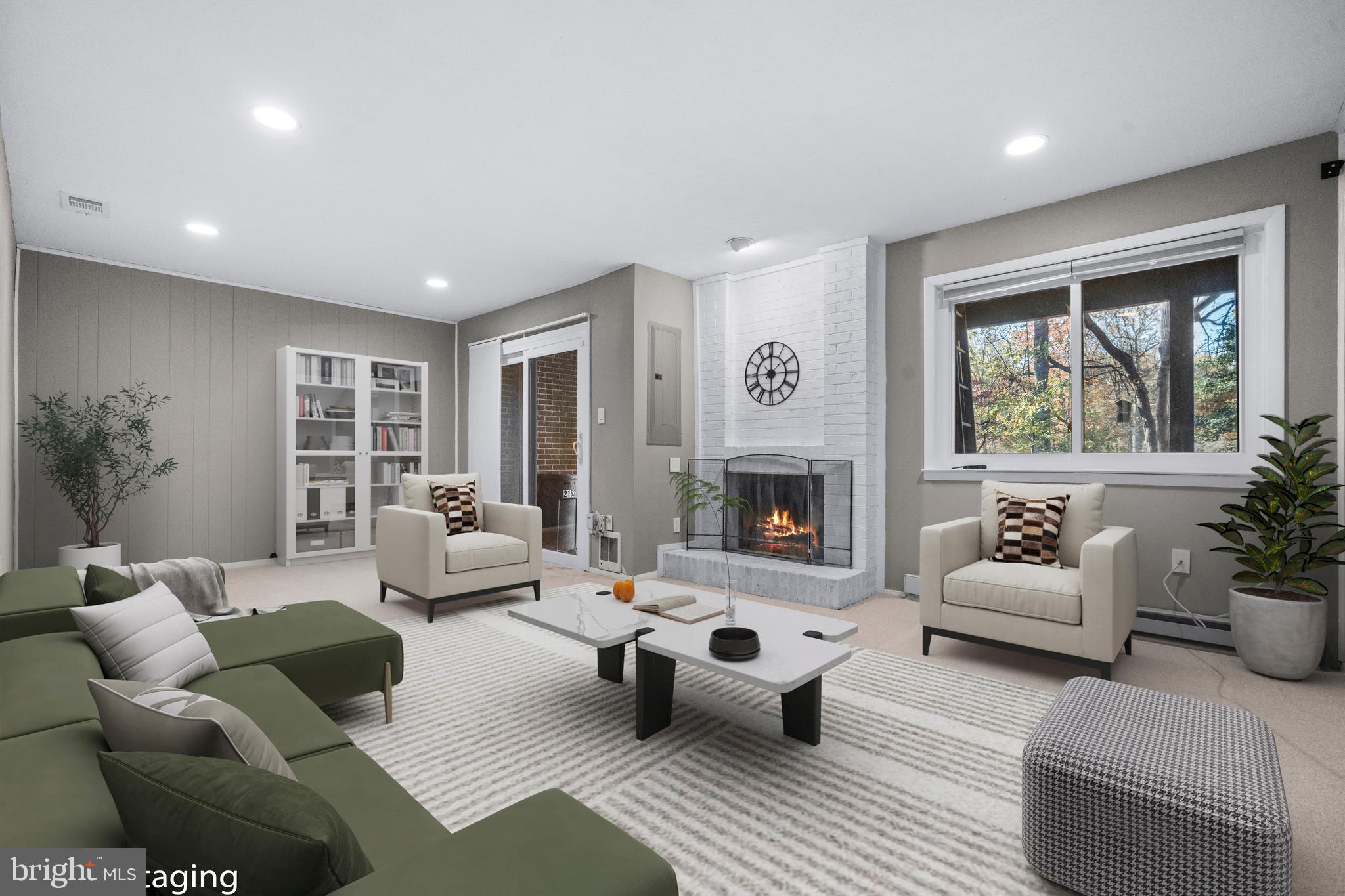 2152 Glencourse Lane Reston, VA 20191 - Photo 29 of 52 a living room with furniture and a fireplace