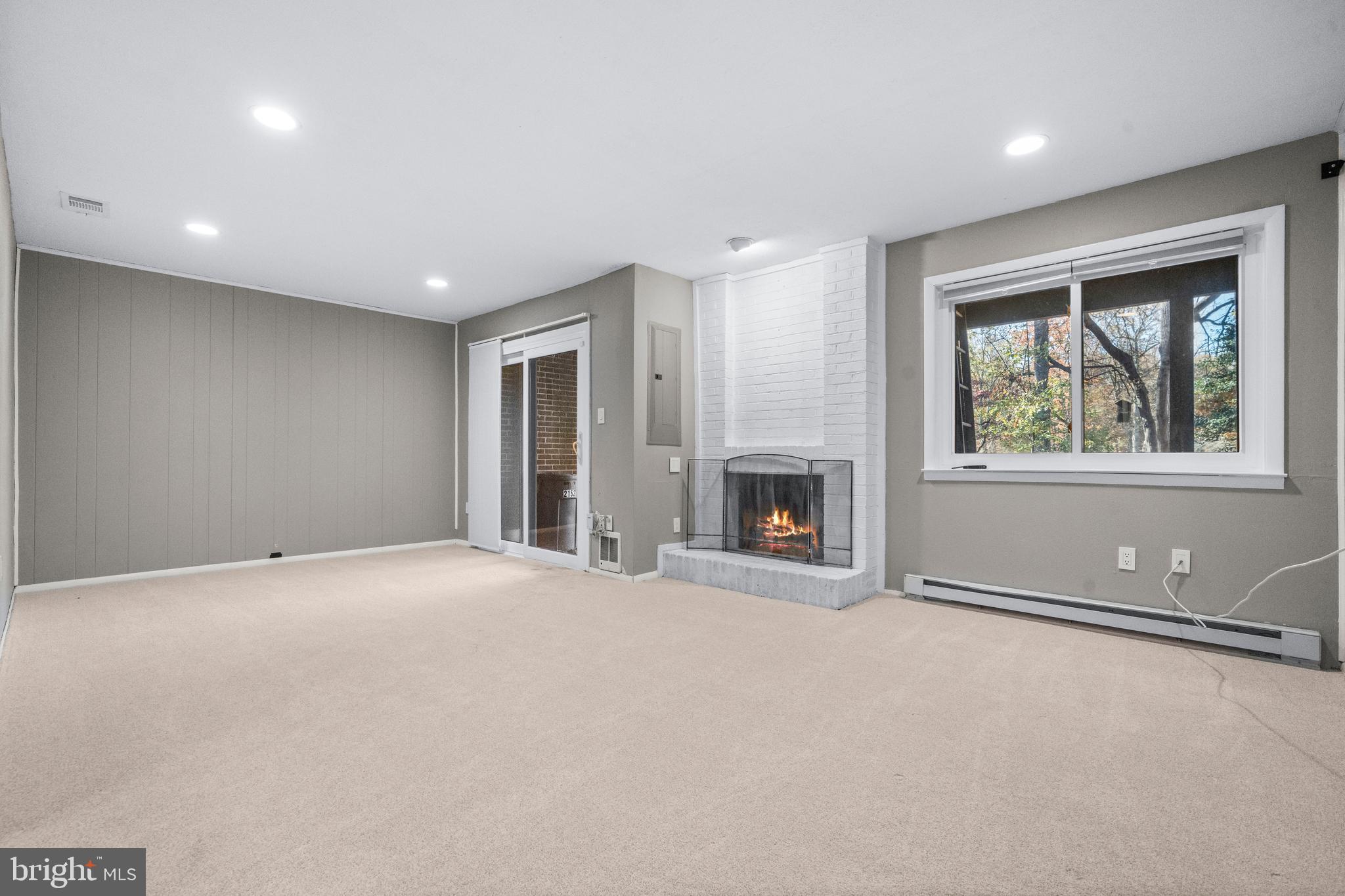 2152 Glencourse Lane Reston, VA 20191 - Photo 30 of 52 an empty room with windows and fireplace